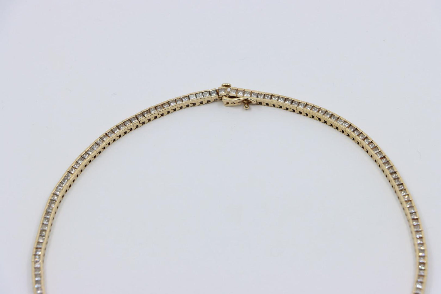 A Pair of Vintage 14K Gold Diamond Bracelets