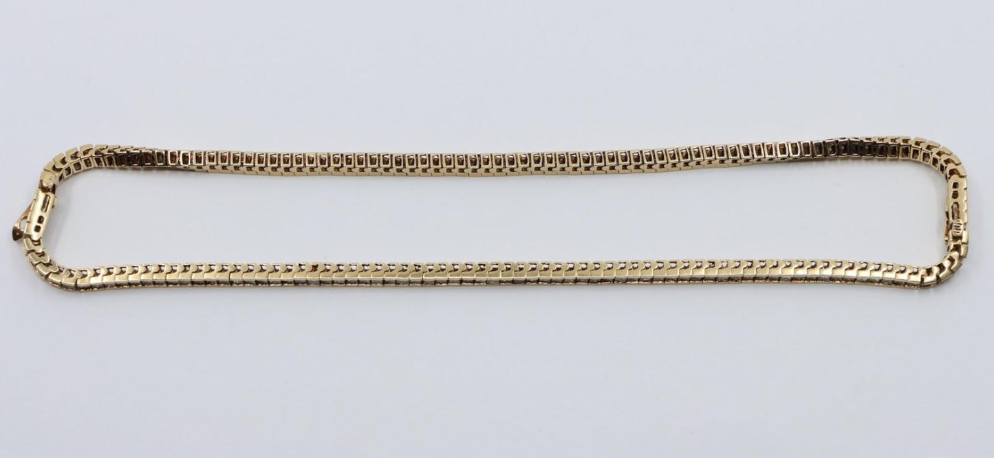 A Pair of Vintage 14K Gold Diamond Bracelets