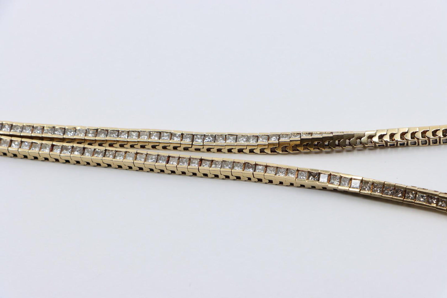 A Pair of Vintage 14K Gold Diamond Bracelets