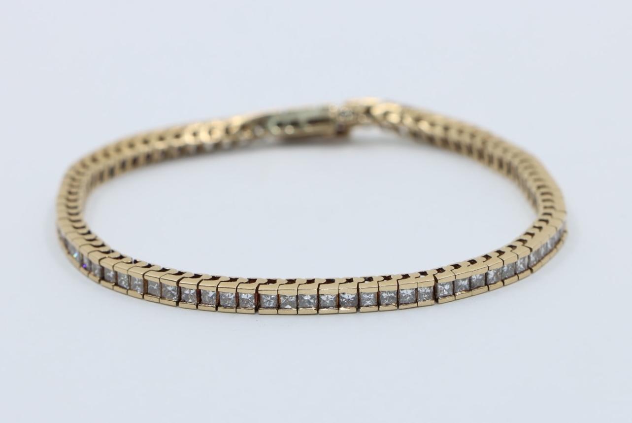A Pair of Vintage 14K Gold Diamond Bracelets