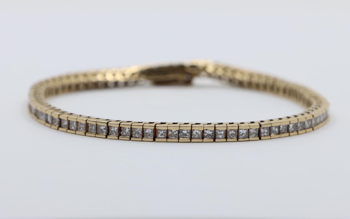 A Pair of Vintage 14K Gold Diamond Bracelets