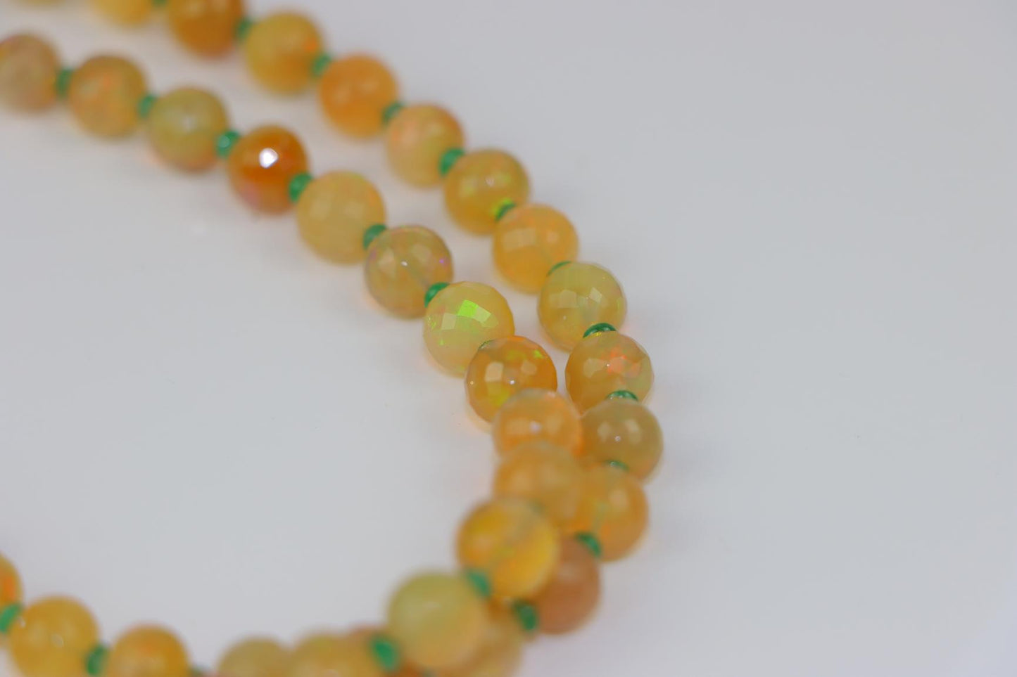A 14K Gold Opal Emerald and Coral Bead Necklace