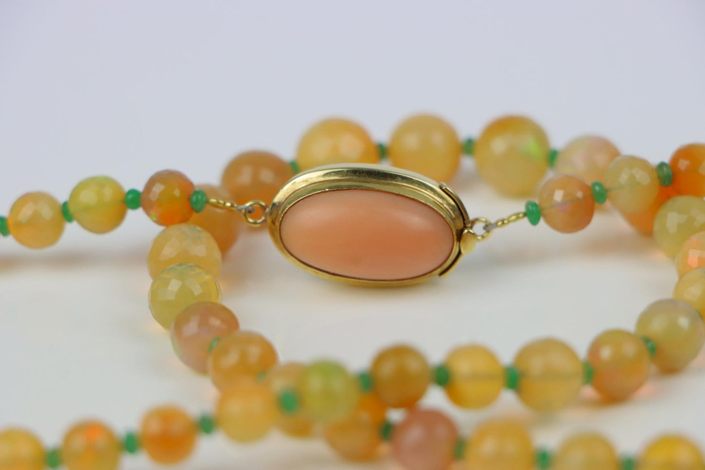 A 14K Gold Opal Emerald and Coral Bead Necklace