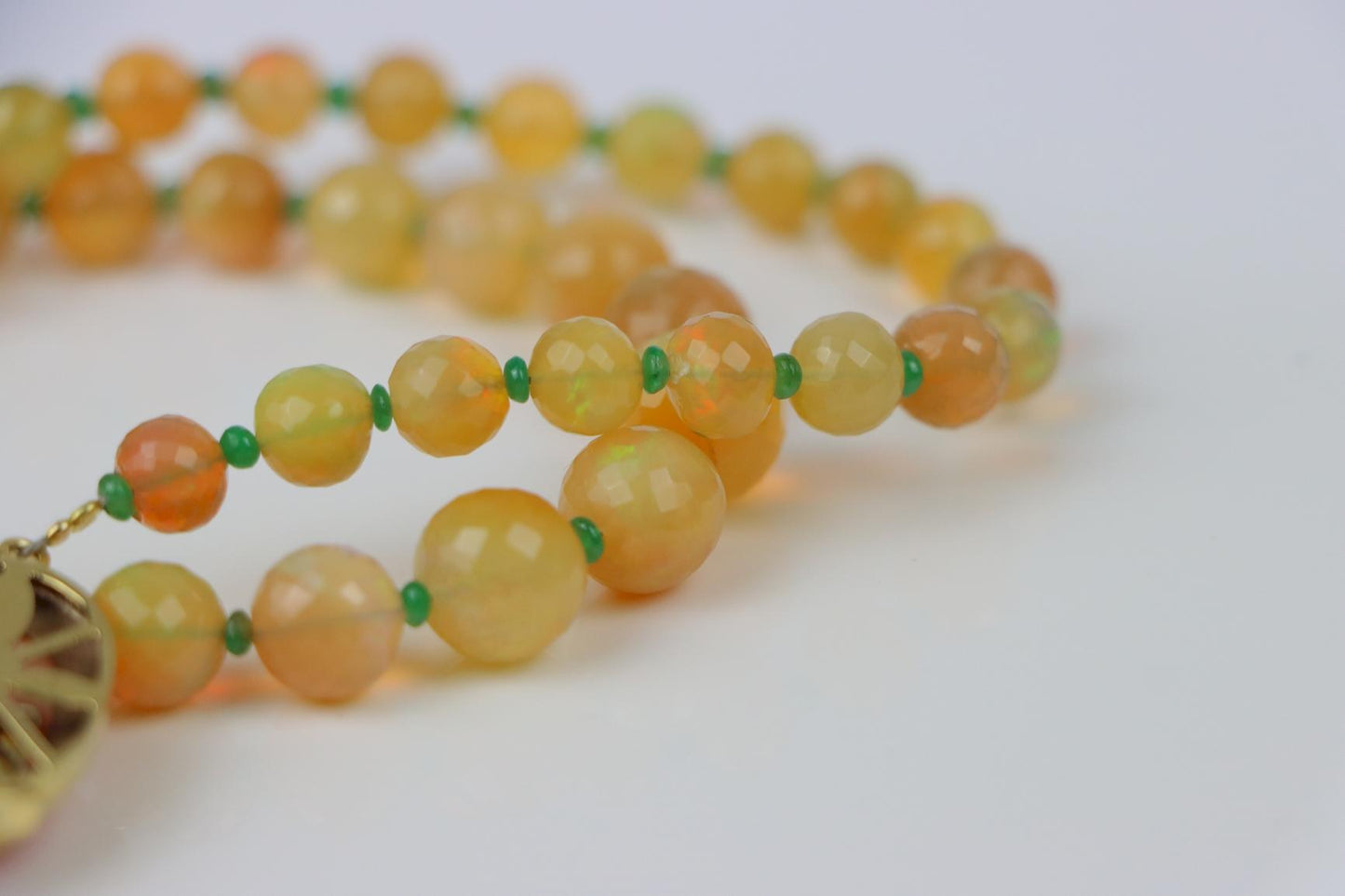 A 14K Gold Opal Emerald and Coral Bead Necklace