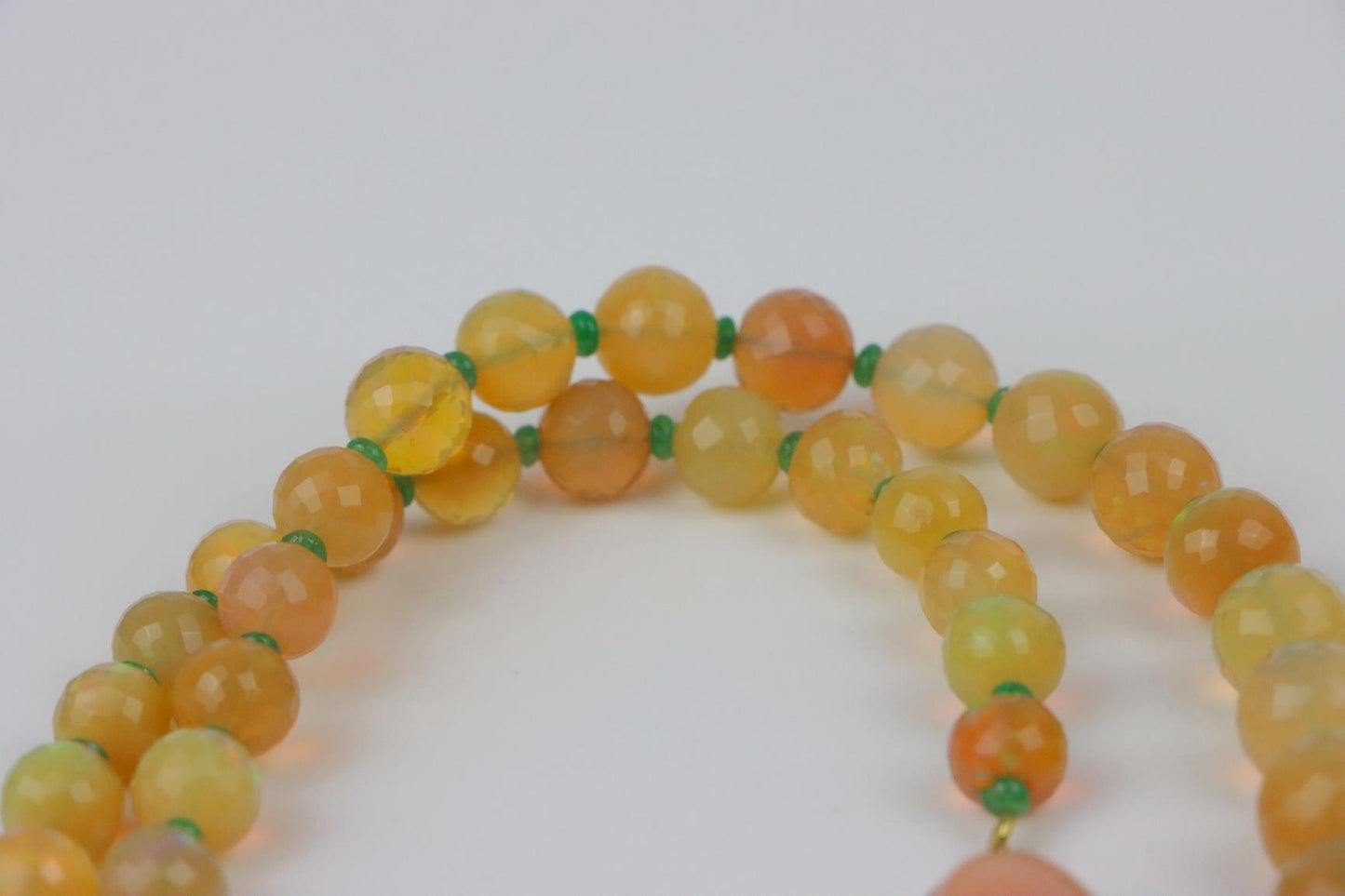 A 14K Gold Opal Emerald and Coral Bead Necklace
