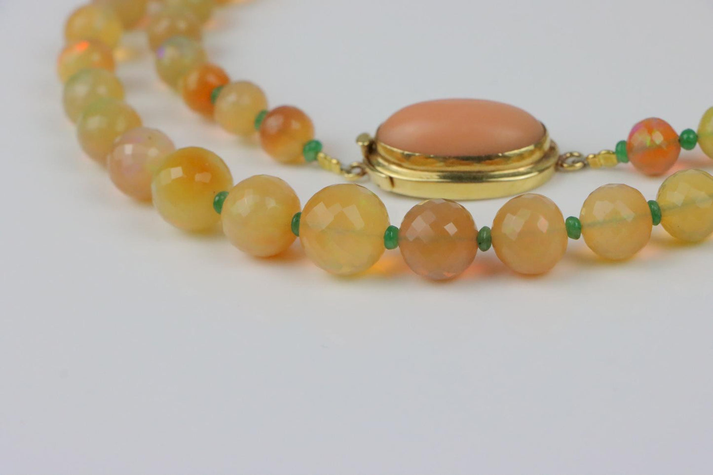A 14K Gold Opal Emerald and Coral Bead Necklace