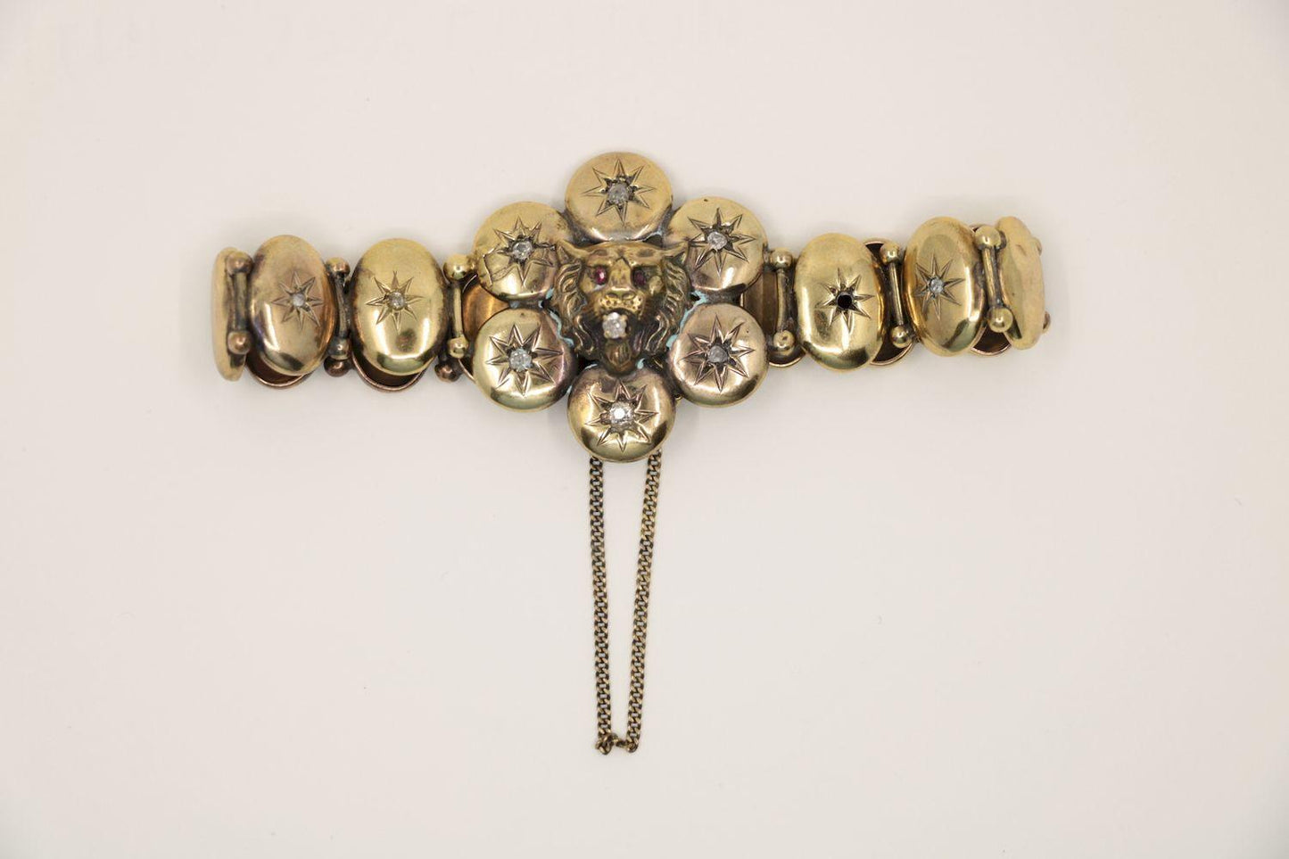 A Victorian 9K Gold Diamond Lion Head Bracelet