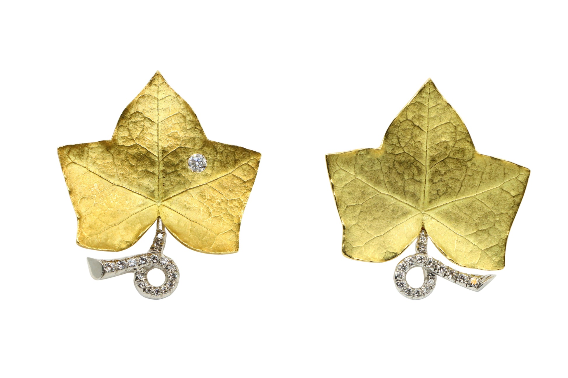 A set of Cartier 18K Gold Platinum Diamond Maple Leaf Clips