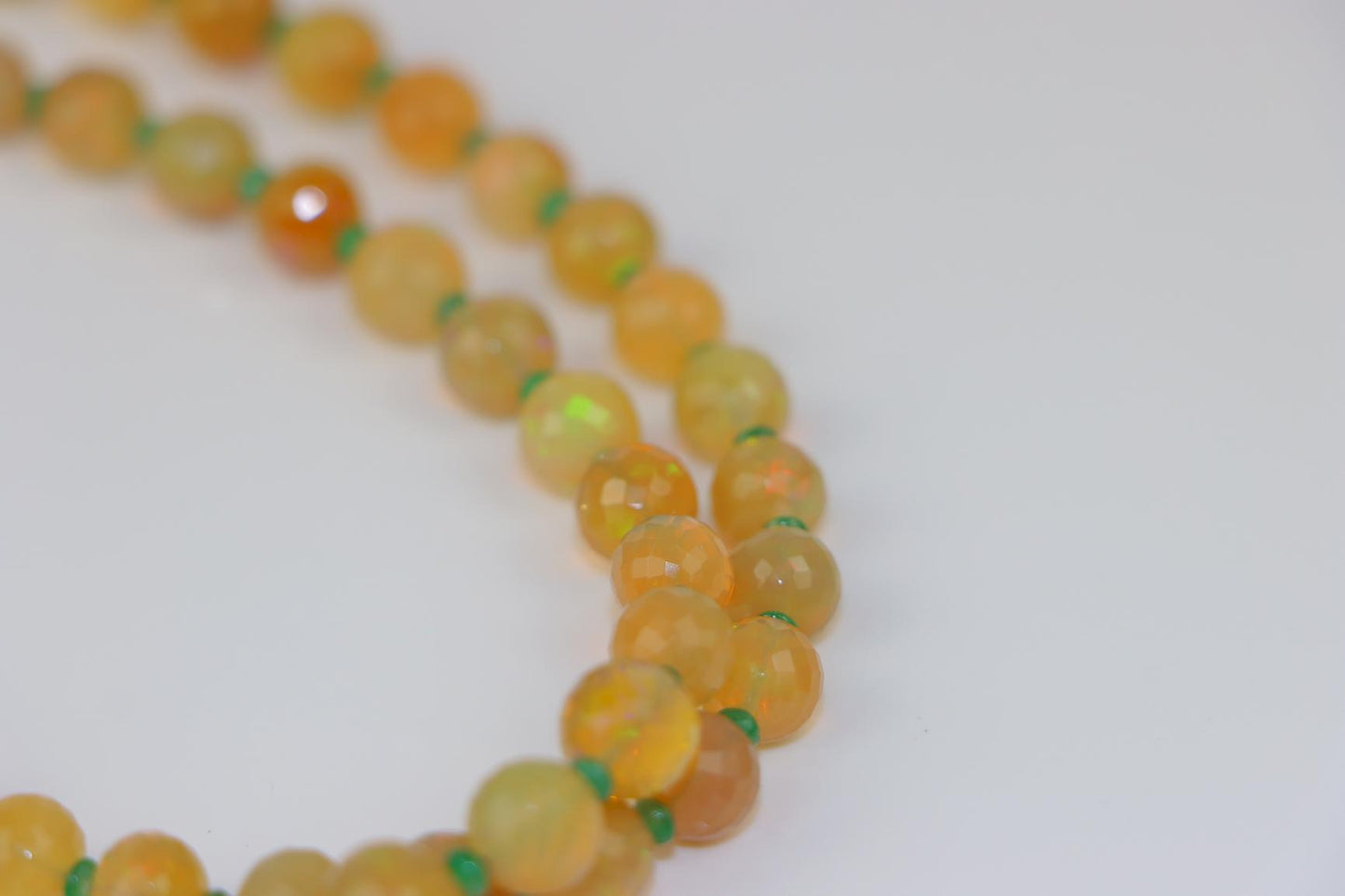 A 14K Gold Opal Emerald and Coral Bead Necklace